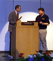 Tom Dean awarding Ian Watson the award